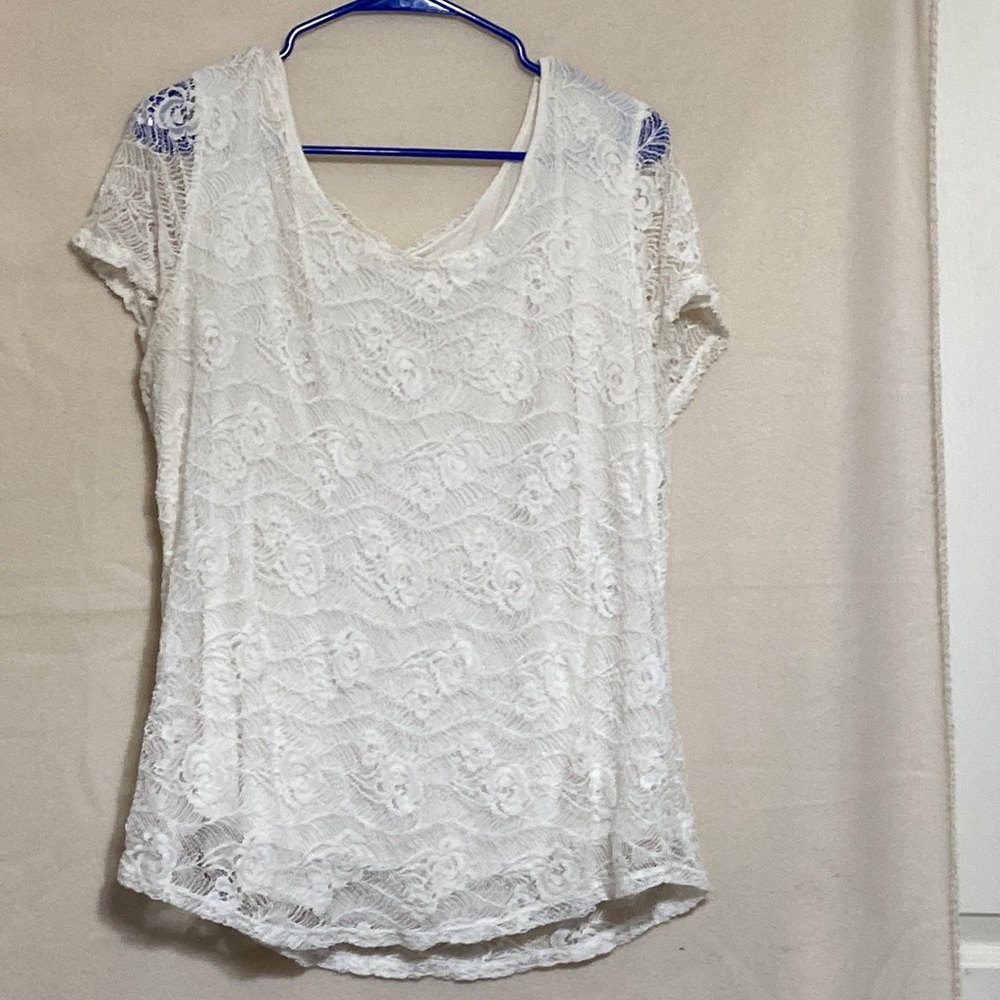 Off white shirt with a lace overlay.